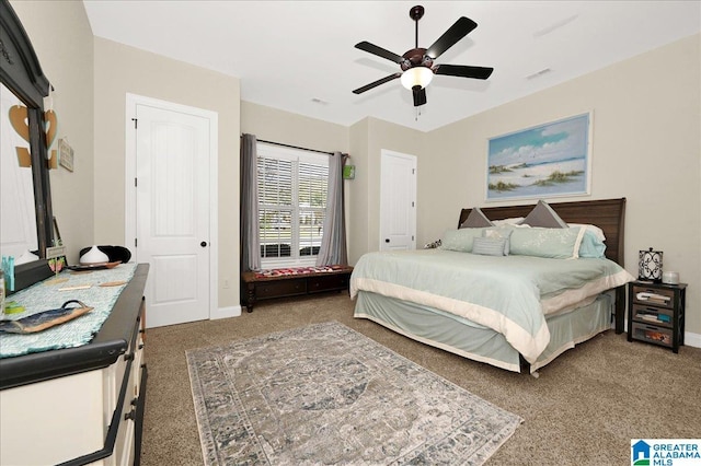 bedroom featuring ceiling fan and dark colored carpet