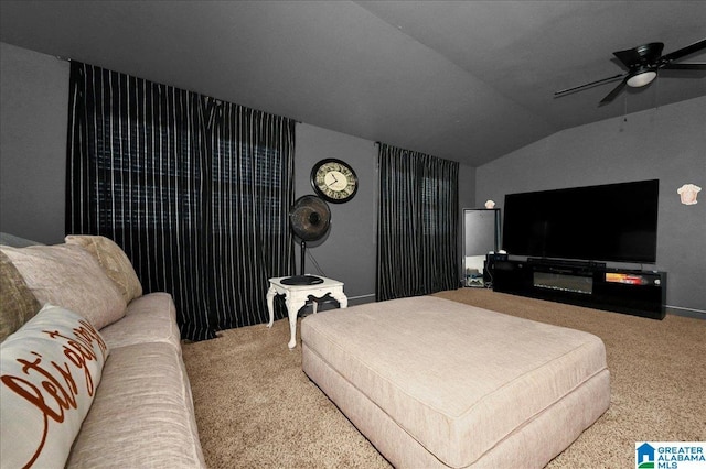 carpeted living room with vaulted ceiling and ceiling fan