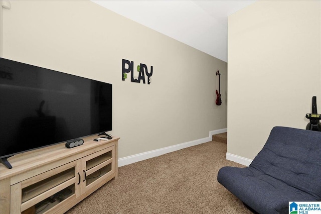 living area with lofted ceiling and carpet floors