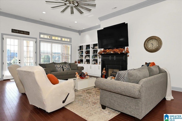 living room featuring crown molding, dark hardwood / wood-style floors, and french doors