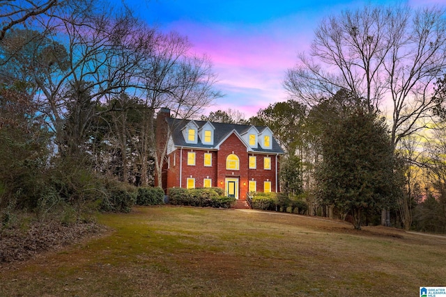 view of front of home with a yard