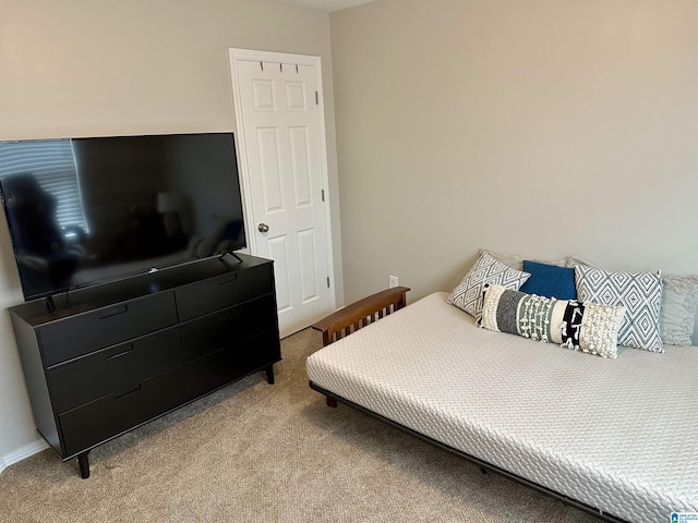 bedroom featuring light colored carpet