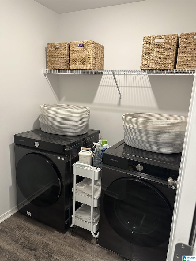 laundry room with laundry area, dark wood finished floors, and baseboards