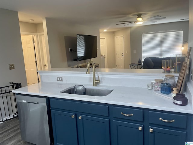 kitchen with a sink, light countertops, dishwasher, and open floor plan