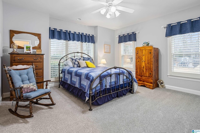 bedroom featuring ceiling fan and carpet