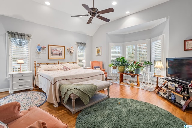 bedroom featuring hardwood / wood-style flooring, vaulted ceiling, and ceiling fan