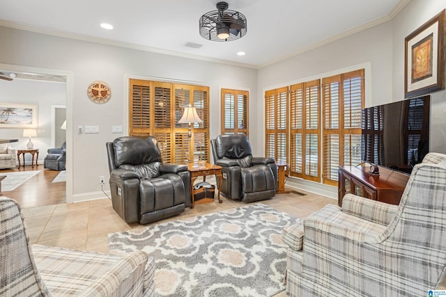 living room featuring crown molding, light tile patterned flooring, and ceiling fan