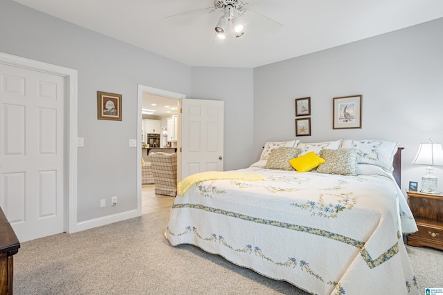 bedroom featuring light colored carpet and ceiling fan