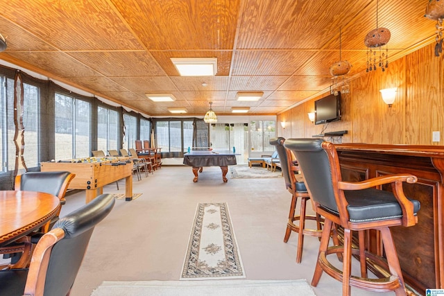 recreation room with wood ceiling, indoor bar, wooden walls, and pool table