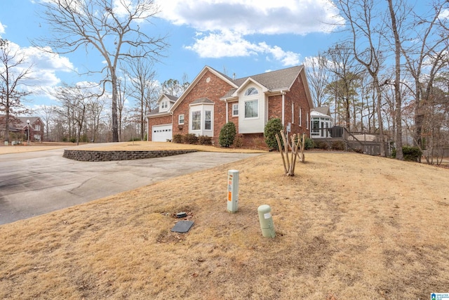 view of front of home with a garage and a front yard