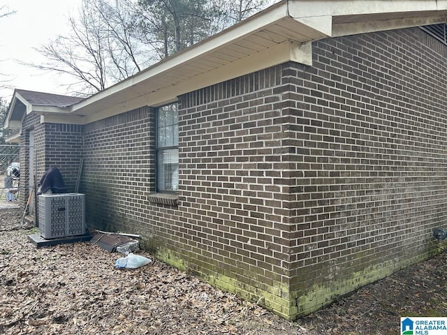 view of property exterior featuring central AC