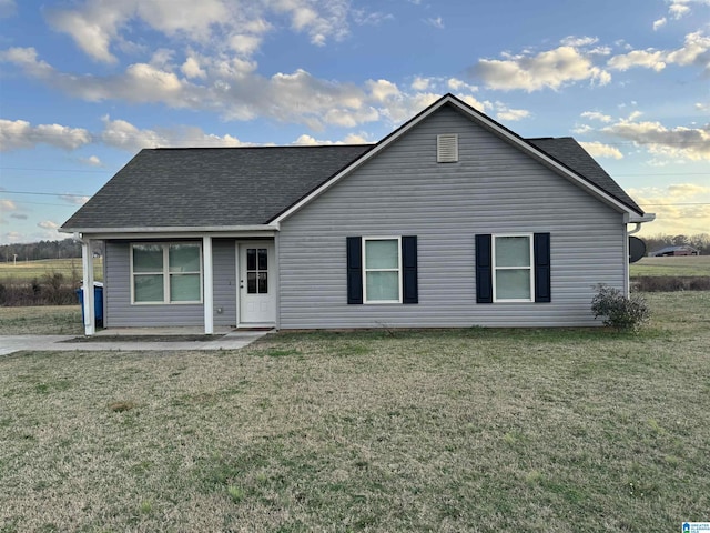 ranch-style house with a patio area and a front yard