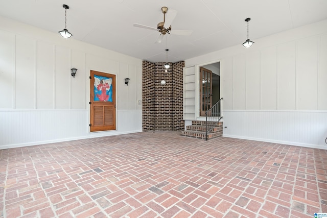 interior space featuring ceiling fan