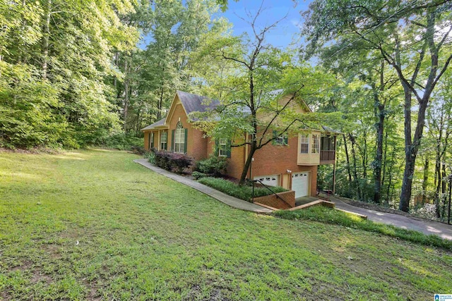 exterior space with a garage and a lawn