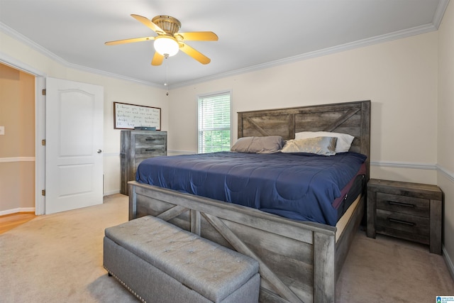 bedroom featuring crown molding, light colored carpet, and ceiling fan