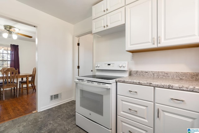 kitchen with white cabinets, electric range, and ceiling fan