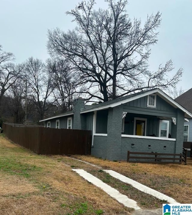 view of property exterior with a lawn