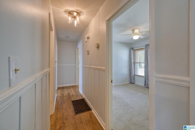 hallway with light carpet