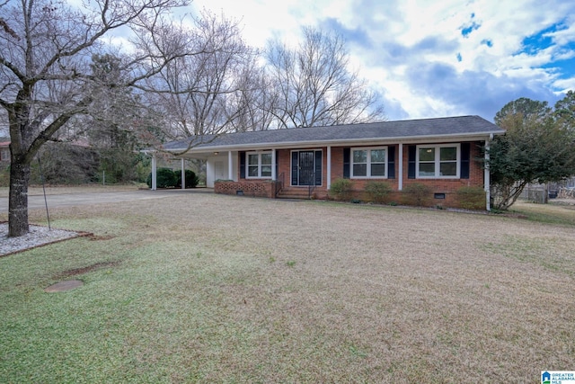 ranch-style home with a front lawn and a carport