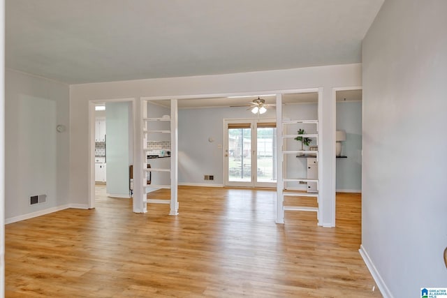 spare room featuring light hardwood / wood-style flooring and ceiling fan