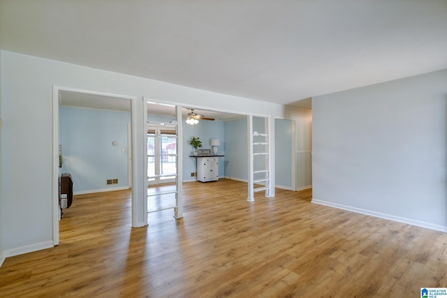 spare room with light hardwood / wood-style floors, french doors, and ceiling fan