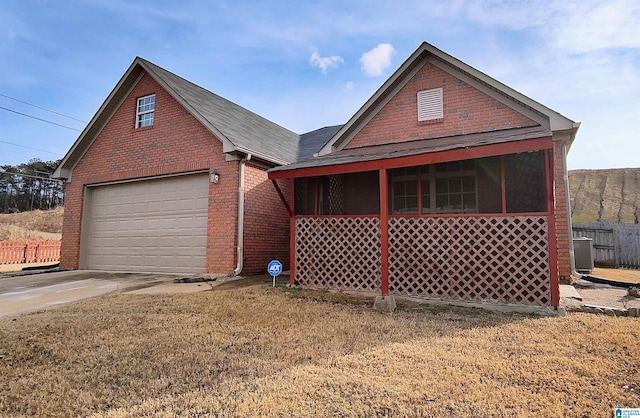 view of front of house with a garage and a front yard