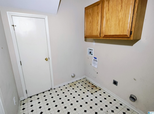 laundry area with cabinets, hookup for a washing machine, and hookup for an electric dryer