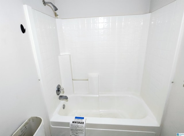 bathroom with bathing tub / shower combination