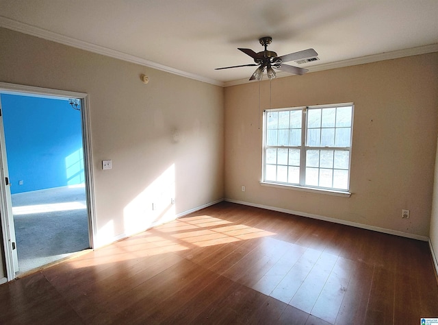 spare room featuring ornamental molding, hardwood / wood-style floors, and ceiling fan