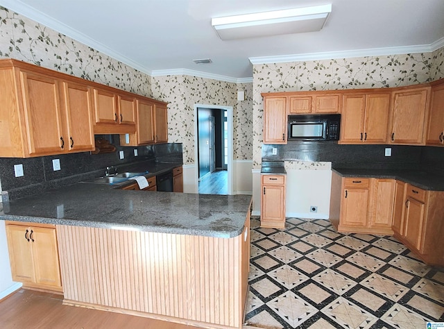 kitchen featuring crown molding, kitchen peninsula, and black appliances