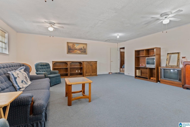 carpeted living room with ceiling fan and a textured ceiling