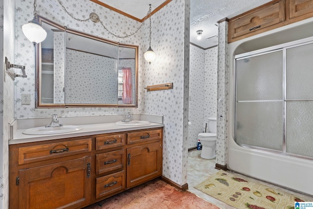 full bathroom with enclosed tub / shower combo, vanity, toilet, and a textured ceiling