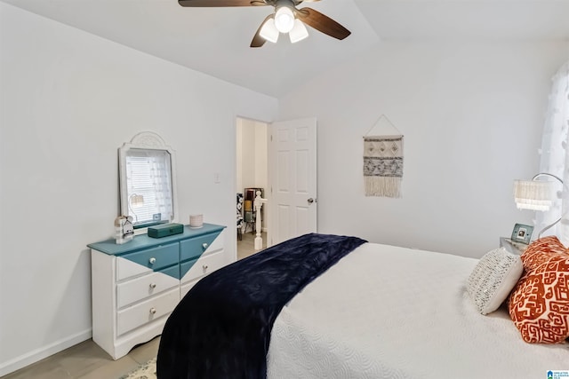 bedroom with ceiling fan and vaulted ceiling