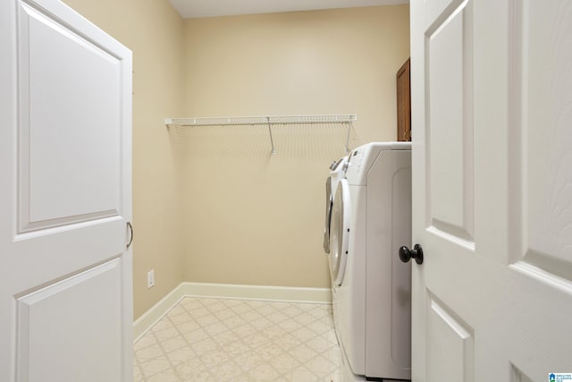 laundry room featuring cabinets and washing machine and clothes dryer