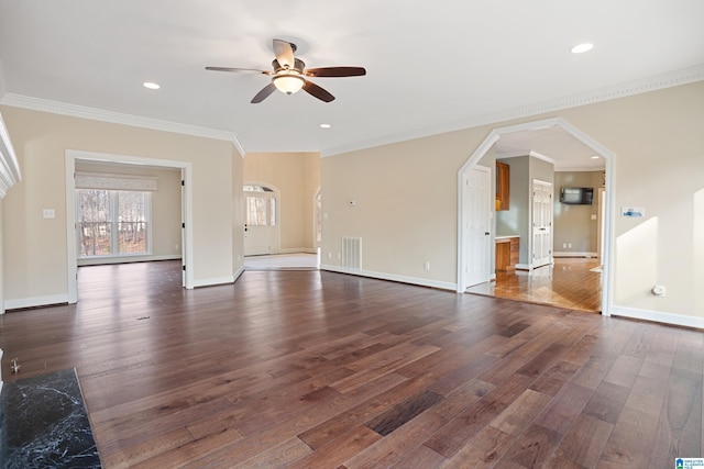 unfurnished living room with ornamental molding, dark wood-type flooring, and ceiling fan