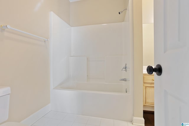 bathroom with shower / tub combination, tile patterned floors, and toilet