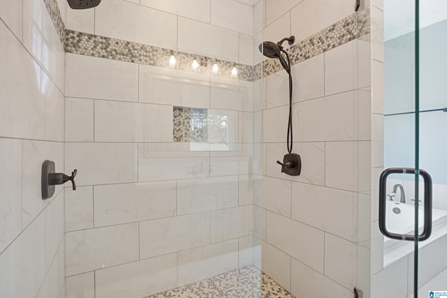 bathroom featuring an enclosed shower