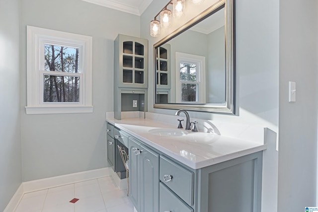 bathroom with vanity, tile patterned flooring, and crown molding