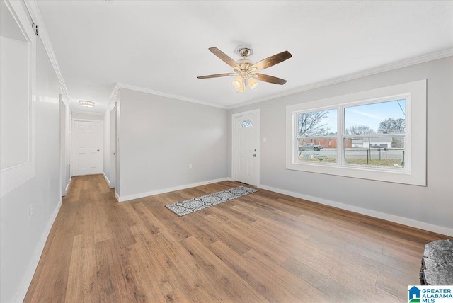 interior space featuring crown molding, ceiling fan, and light wood-type flooring