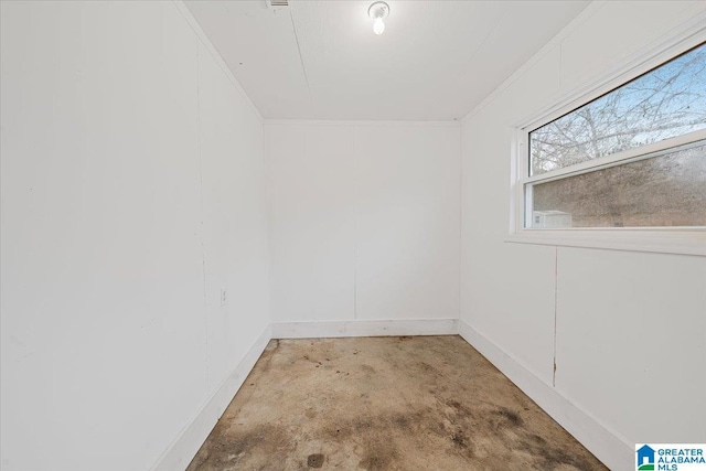 unfurnished room featuring ornamental molding