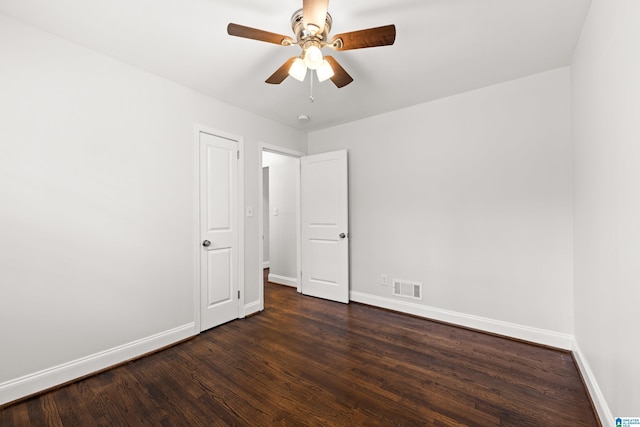 unfurnished bedroom with dark hardwood / wood-style floors and ceiling fan