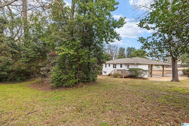 view of yard with a deck