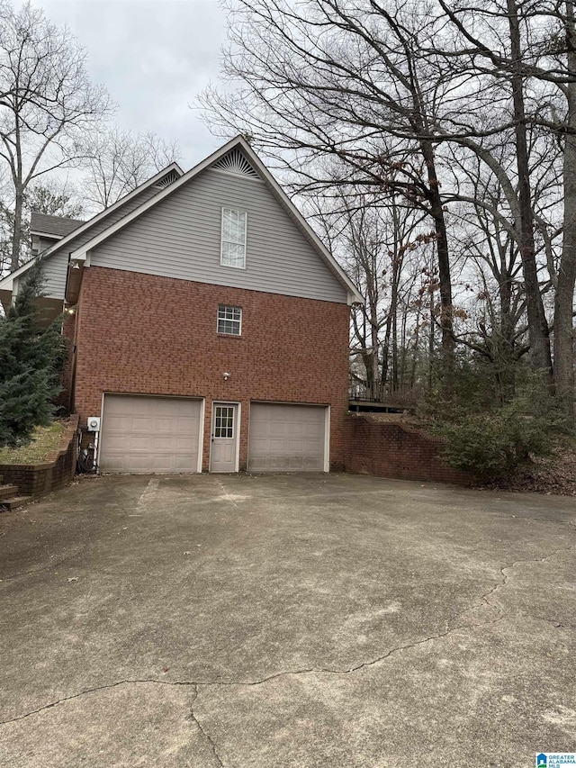 view of side of property featuring a garage