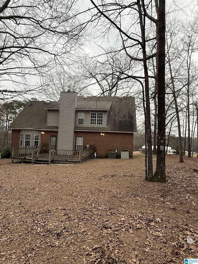 view of front of home featuring central AC unit and a deck