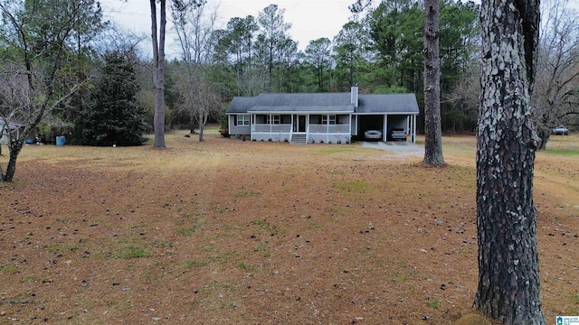 single story home featuring a carport and a porch