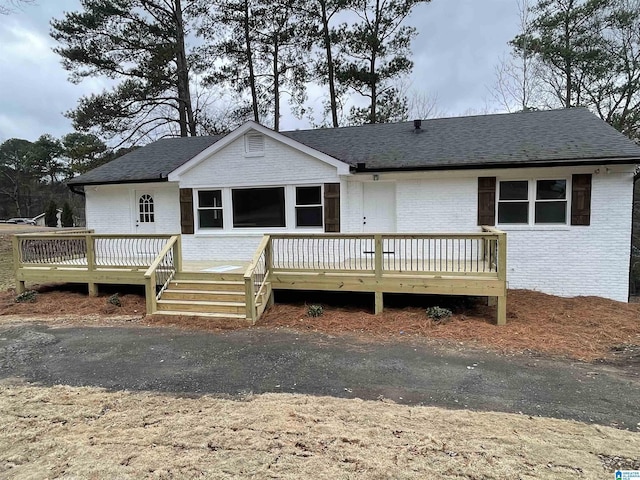 view of front of home with a wooden deck