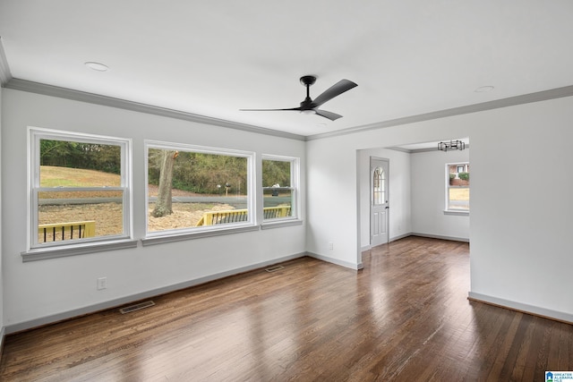 unfurnished room featuring hardwood / wood-style floors, crown molding, and ceiling fan