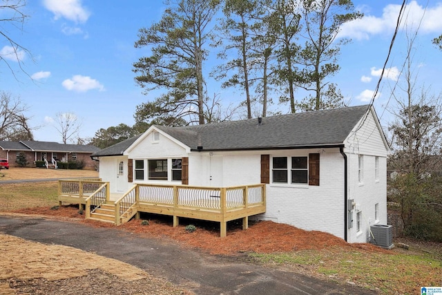 back of property featuring a wooden deck and central air condition unit