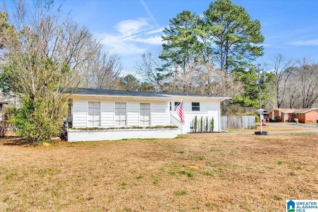 ranch-style house with a front yard