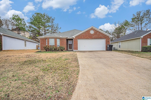 ranch-style house featuring a garage and a front yard